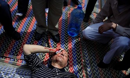 Supporters of the Bulgarian ultra-nationalist party Ataka, or 'Attack, (L), clash with Muslim worshippers during Friday prayer in front of the Banya Bashi Mosque in Sofia, Bulgaria